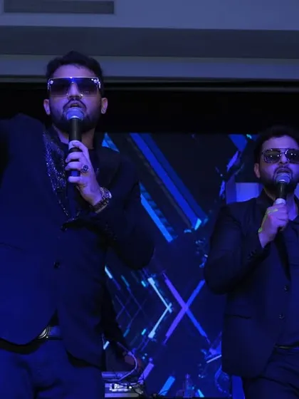 The lead singers of Dilli Rockers Band commanding the stage during a New Year's performance. I focus on capturing the artists' stage presence and energy.