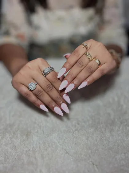 A simple and clean set of light pink stiletto nails. Perfecting nail shaping and solid color application are the most important skills you'll learn.