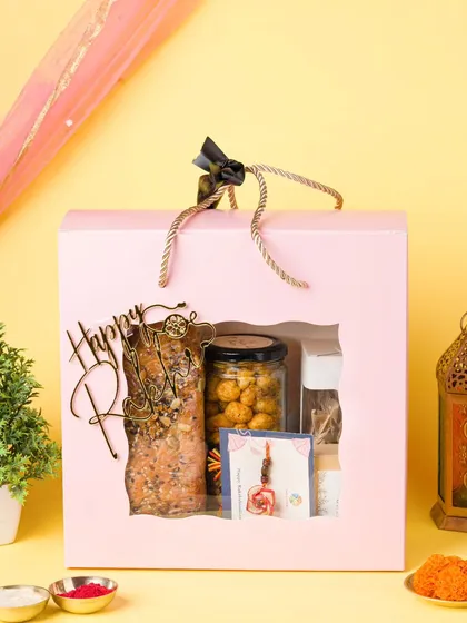 A Rakshabandhan gift hamper for a bakery, styled with traditional elements like a rakhi and roli. We create themed setups for all major Indian festivals.
