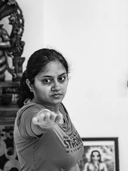 A practitioner holds a pose with focus and determination. Yoga is a journey of connecting with the self through asana, pranayama, and meditation.