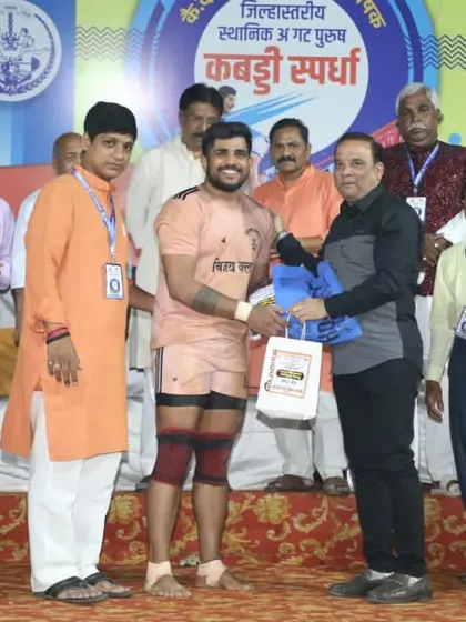 Vijay Divekar being felicitated on stage for his match-winning performance.