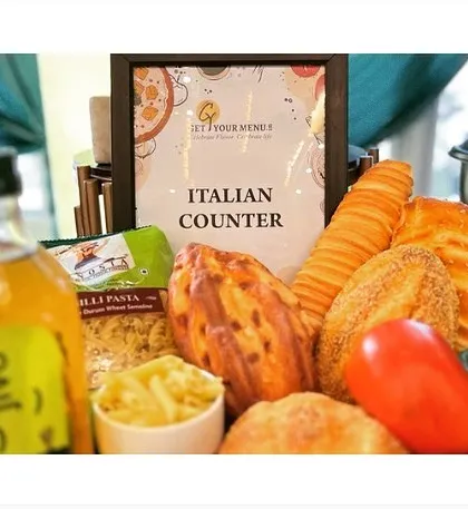 The decor for our live Italian counter, featuring fresh breads, pasta, and vegetables to signal the authentic cuisine being served.