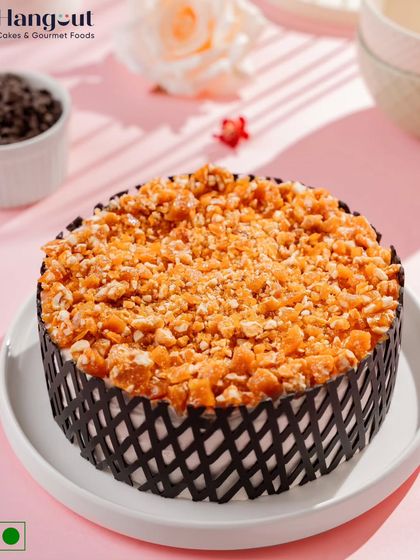 Our Praline Butterscotch Cake is pure bliss. It's a symphony of velvety layers, light whipped cream, and the irresistible crunch of cashew nougat.