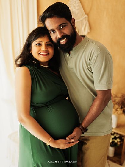 This couple's portrait is full of warmth and happiness. Their coordinated outfits in earthy green and beige work perfectly with the boho theme.