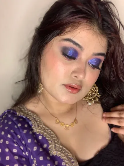 Another angle of the intense purple smokey eye, showing the shimmer and blending on the eyelid.