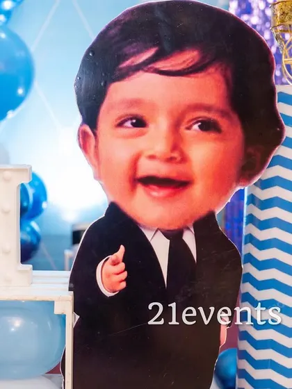 A close-up of a personalized face cutout, adding a fun and unique touch to the Boss Baby theme.