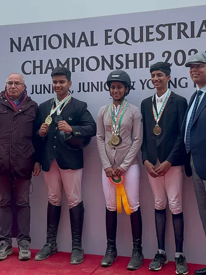 The gold medal team for young rider dressage at the National Championship. Team events foster camaraderie and sportsmanship among our students.