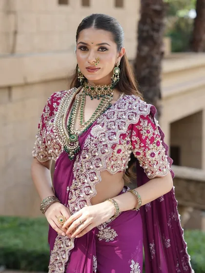 A closer look at the details. The makeup features soft radiance and defined eyes, balancing the grandeur of the layered necklaces and intricate blouse.