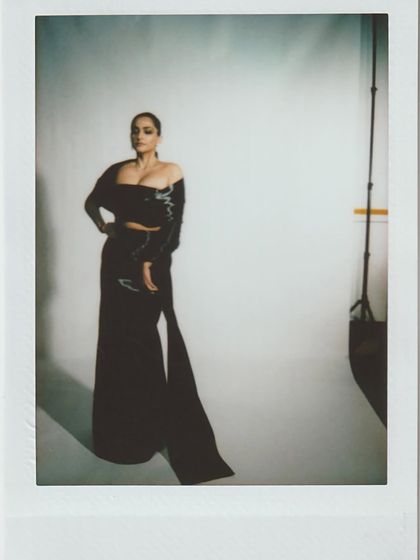 A polaroid from the studio, capturing the full silhouette of Sonam Kapoor's stunning metal wire saree gown.