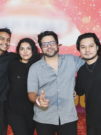 A post-show group photo with some of our band members. The camaraderie and fun we have off-stage translates directly to our energy on-stage.