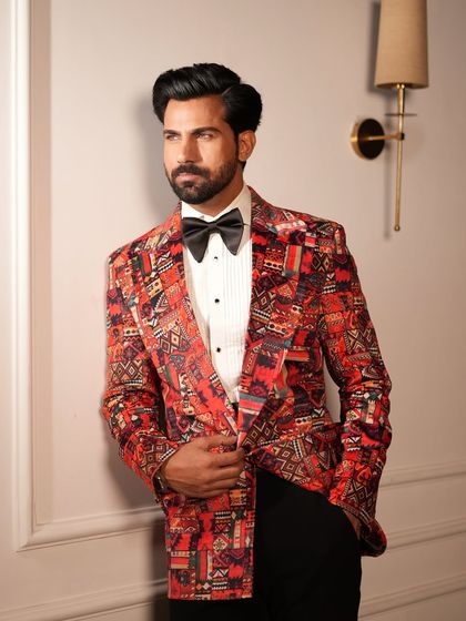 Bold and distinctive, our Cantaloupe Tuxedo features a vibrant, multi-colored geometric pattern. This is a conversation-starting piece for any cocktail party or celebratory evening.
