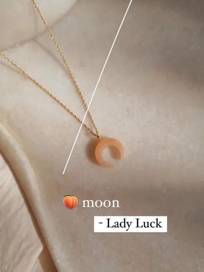 This is my 'avah' crescent pendant, carved from peach moonstone. I call it my "Lady Luck" charm, as it's known to soothe emotional pain and sorrow.