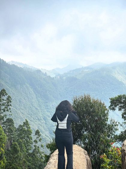 A trekker looking out at the valley from Dolphin's Nose.