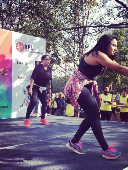 Another action shot from the "Run for a Cause" event. The energy on stage was fantastic, and it was amazing to see so many people from the Bangalore running community come together to move and make a difference.