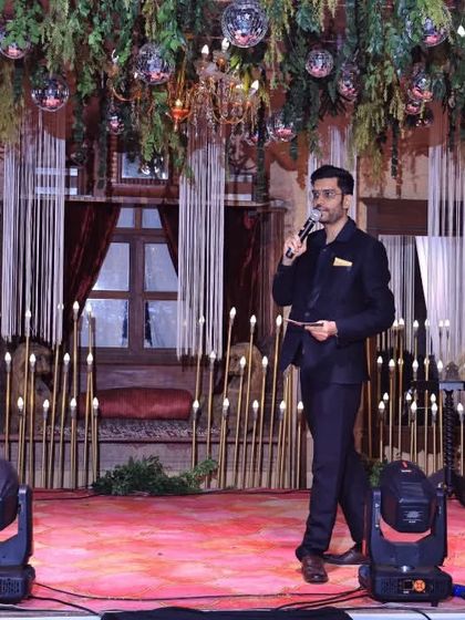 Walking the stage at a Sangeet, making sure every corner of the venue feels the energy and excitement.
