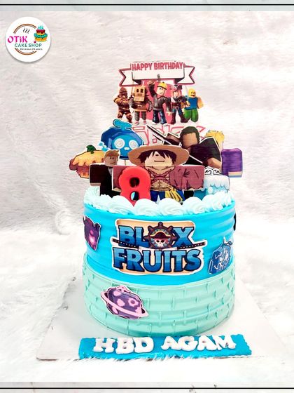 For the gamer in your family, we designed this Blox Fruits themed cake. The cake is decorated with edible images and logos from the popular game, ready for an 18th birthday adventure.