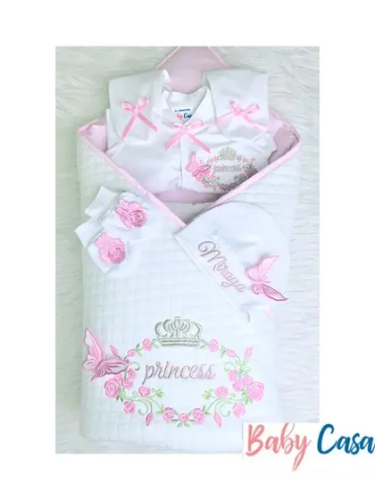 A princess themed set for baby Miraya. This pink and white collection includes a wrap with a floral crown and butterfly embroidery, along with a matching personalized romper.