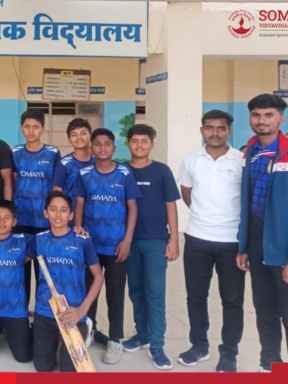 The U-14 Boys tennis cricket team and their coaches celebrate their district-level championship, a significant achievement for our young athletes.