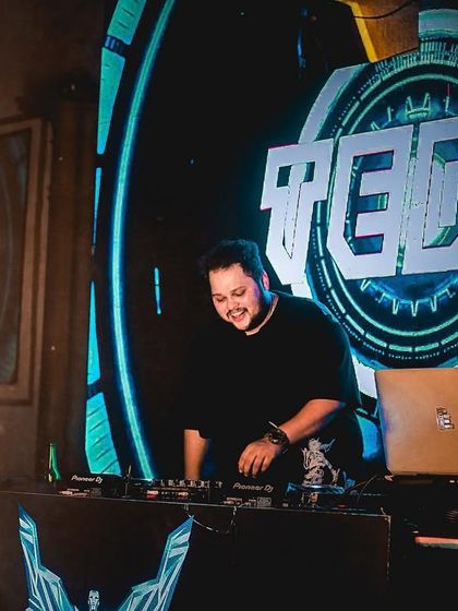 Be happy with what you have while working for what you want. A smiling shot of me at the console with pyro in the background.