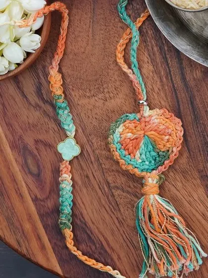 The orange and green Lumba and Rakhi combo set. A beautiful way to celebrate your sibling bond.