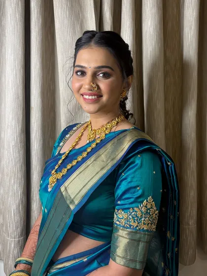 Soniya's first engagement look in a beautiful blue traditional saree.