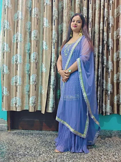 A full-length view of the periwinkle blue sharara set, showing its graceful silhouette and comfortable fit.