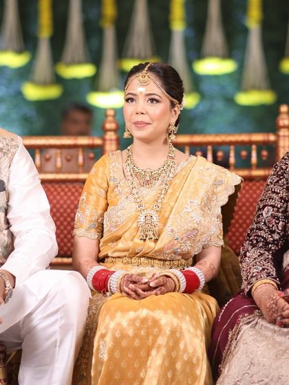 The bride during her wedding ceremony, her hair staying perfectly in place.