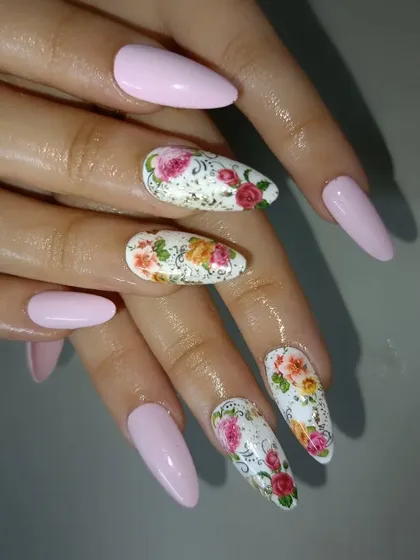 A closer view of the intricate, hand-painted floral accent nails.