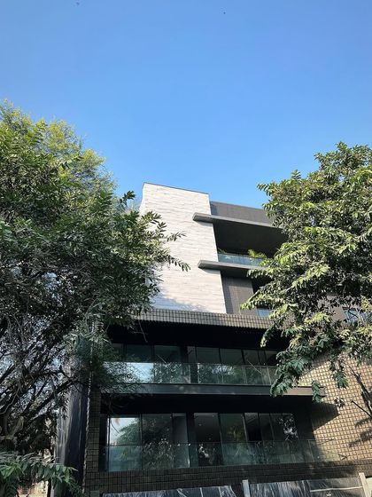 A building facade featuring our concrete planks with a wood-like texture. This innovative product offers the aesthetic of wood with the durability and weather resistance of concrete.