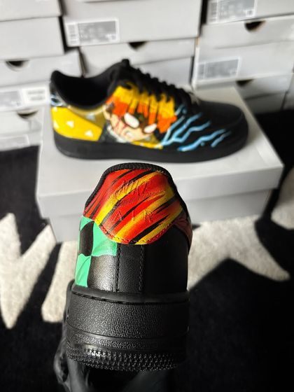 A close-up of the heel of the Demon Slayer custom sneakers, showing the iconic patterns of Tanjiro's and Zenitsu's haoris.