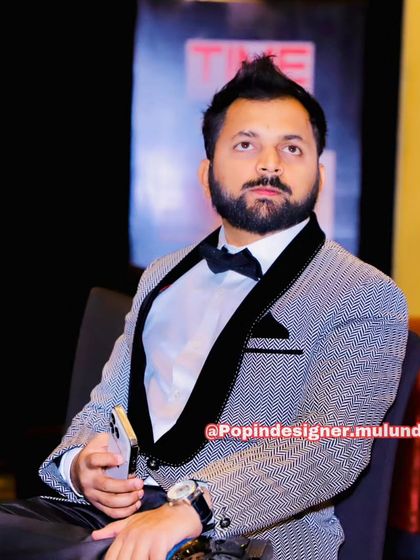 A happy client looking sharp in a patterned grey and black tuxedo jacket. This is a great example of the unique designer pieces I have available for rent.