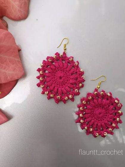 These bright pink beaded earrings have a beautiful floral or sunburst design. They are ready to ship or can be made in bulk for resellers or gifts.