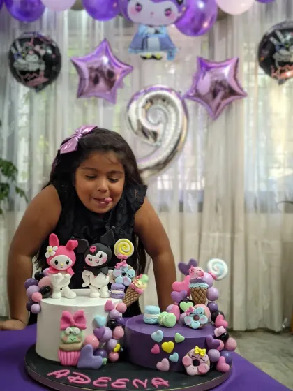 My daughter Adeena making a funny face as she gets ready to blow out the candles on her Kuromi and My Melody birthday cake. These are the moments I cherish forever.