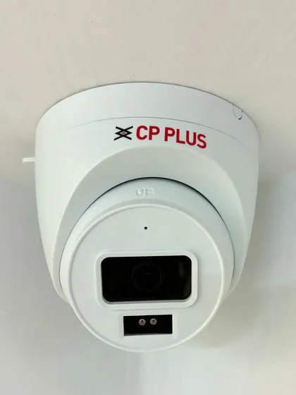 The final result of a ceiling-mounted dome camera. It's clean, discreet, and perfectly integrated into the office environment.