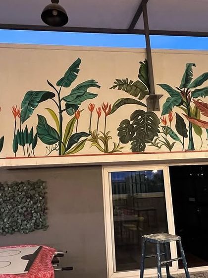 This large tropical mural was for a co-working space. The long, horizontal design fills the wall and adds a burst of natural energy to the common area.
