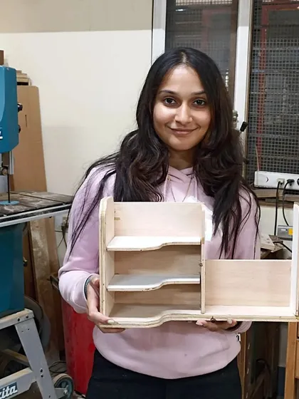 A stylish and practical makeup or desk organizer, designed and built by a student. The curved partitions add a soft, organic touch to the piece.