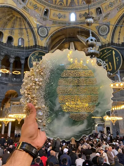 It was a blessing to bring my art to the grand Hagia Sophia. This photo captures my Ayat ul Kursi plaque, handcrafted with green and white resin, within the walls of this historic and spiritual place.