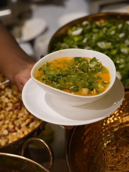 A warm and comforting bowl of Khaosuey, a Burmese noodle soup. While not strictly Indian, its flavors are beloved in India, and it's a popular choice on my diverse menus.