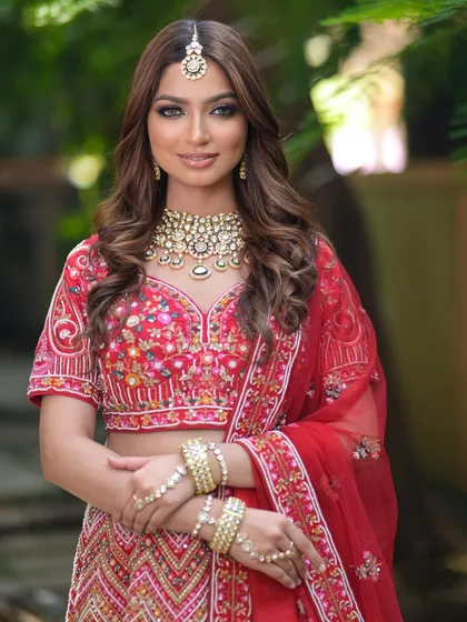 A full view of a stunning bridal lehenga paired with one of my signature polki sets. This jewellery is designed to complement intricate outfits while making its own statement of elegance.