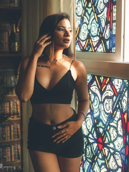 Light can be a powerful tool. Here, I used the dramatic light from a stained-glass window to sculpt the subject and create a portrait that is both bold and enigmatic, blending sensuality with art.