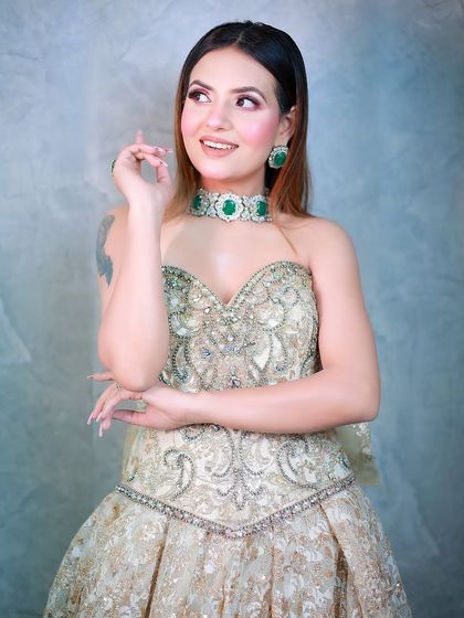 A candid and happy pose that adds a touch of spontaneity to this glamorous gown shoot.