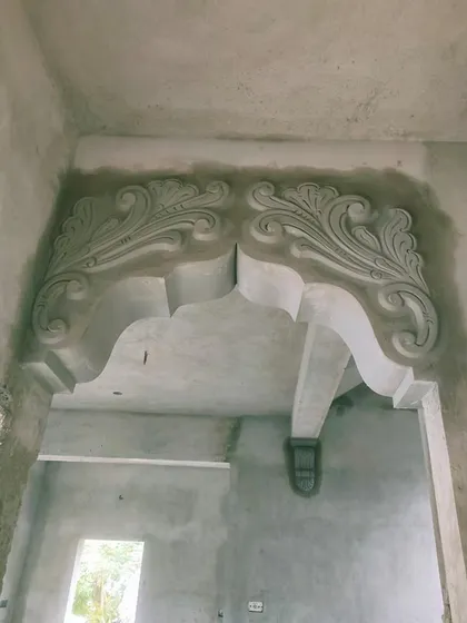 A grand, ornate archway I sculpted for a hall entrance. This kind of custom cement work makes a bold statement and adds a sense of luxury to the space.