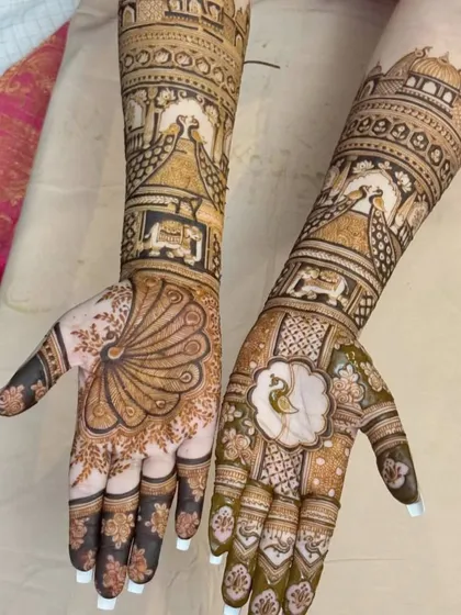A unique take on the peacock theme, with one hand featuring a full peacock tail and the other a more abstract floral pattern. This asymmetrical design is perfect for a modern bride.