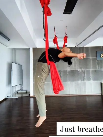 A deep, supported backbend in the aerial hammock. A reminder to just breathe and let go.