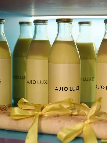 Even our beverages are part of the story. For the Ajio Luxe pop-up, we served custom-branded juices and baguettes with chic yellow bows, ensuring every detail reflected the event's sophisticated aesthetic.