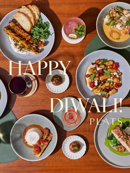 A festive "Happy Diwali" message over a beautiful spread of our food.