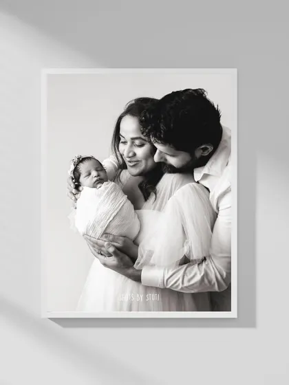 There is something so powerful about a family's first portrait. This black and white image freezes a quiet, tender moment with their newborn, a memory that will hang on their wall and in their hearts forever.