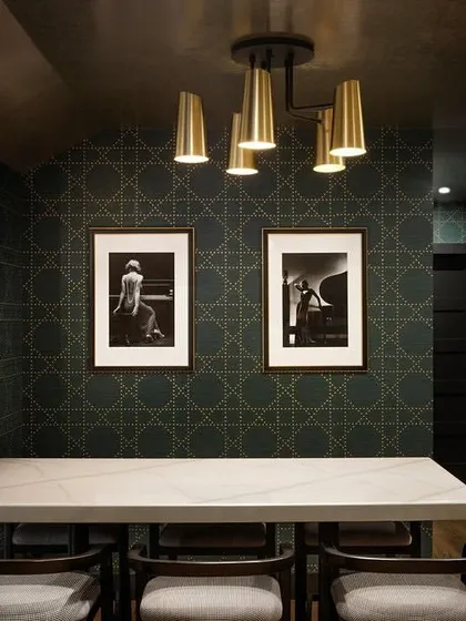 This elegant wine cellar features our Styled in Studs collection. The refined geometric pattern in a deep green adds modern sophistication and timeless style, creating the perfect atmosphere for showcasing a curated collection.