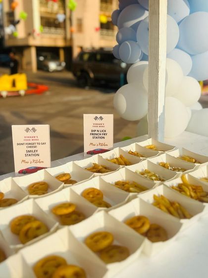The 'Dip N Lick' French Fry and Smiley Station is always a crowd-pleaser. Here it is set up for a car-themed party, ready for kids to grab and go.