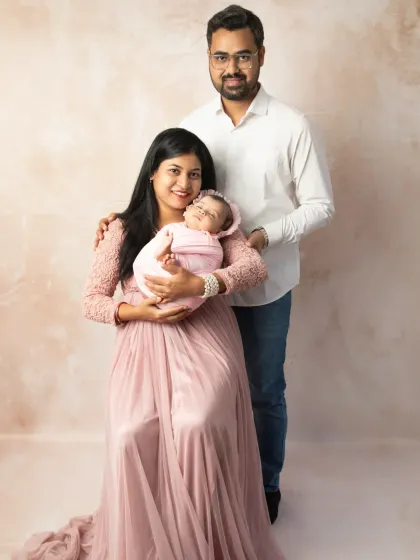 The first family portrait is a memory to cherish forever. I love bringing parents and their new baby together to capture the complete story of your family's love in a simple, elegant setting.